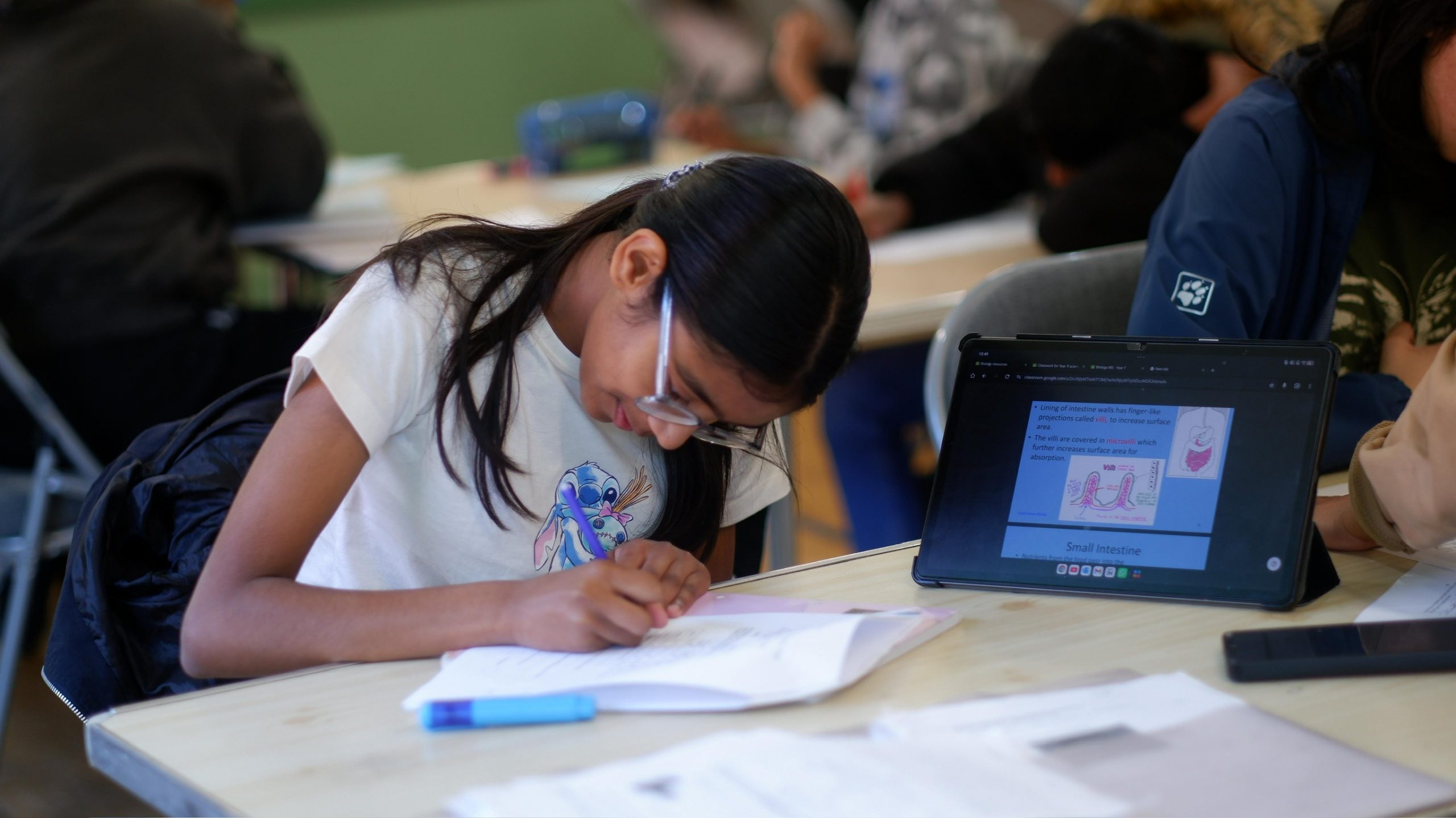a young girl writing