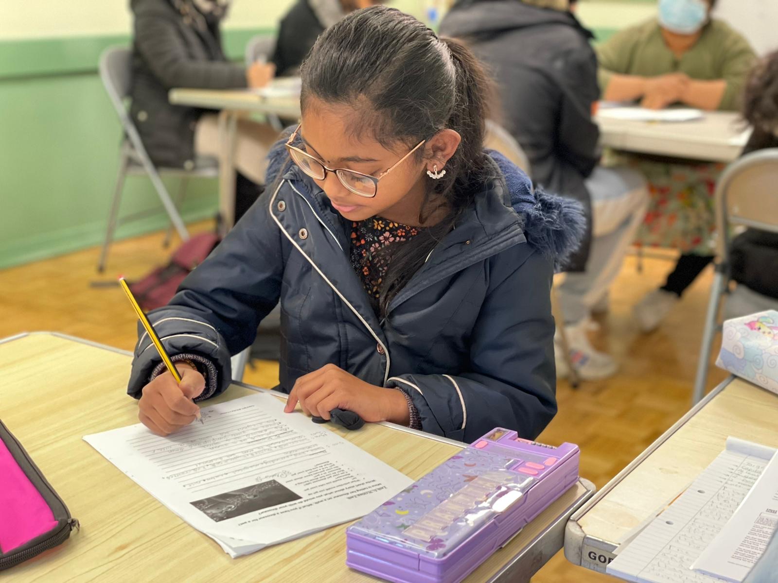 a young girl studying at ruby's tuition