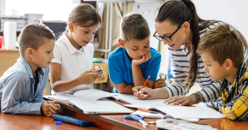 Focused learning session at Ruby's tuition, where personalized guidance helps young students excel in their studies.